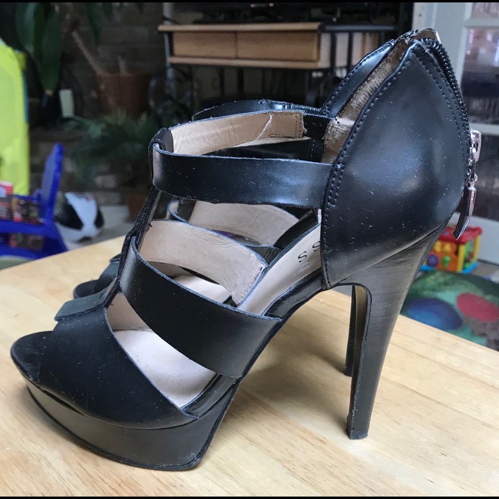 Black leather platform heels.